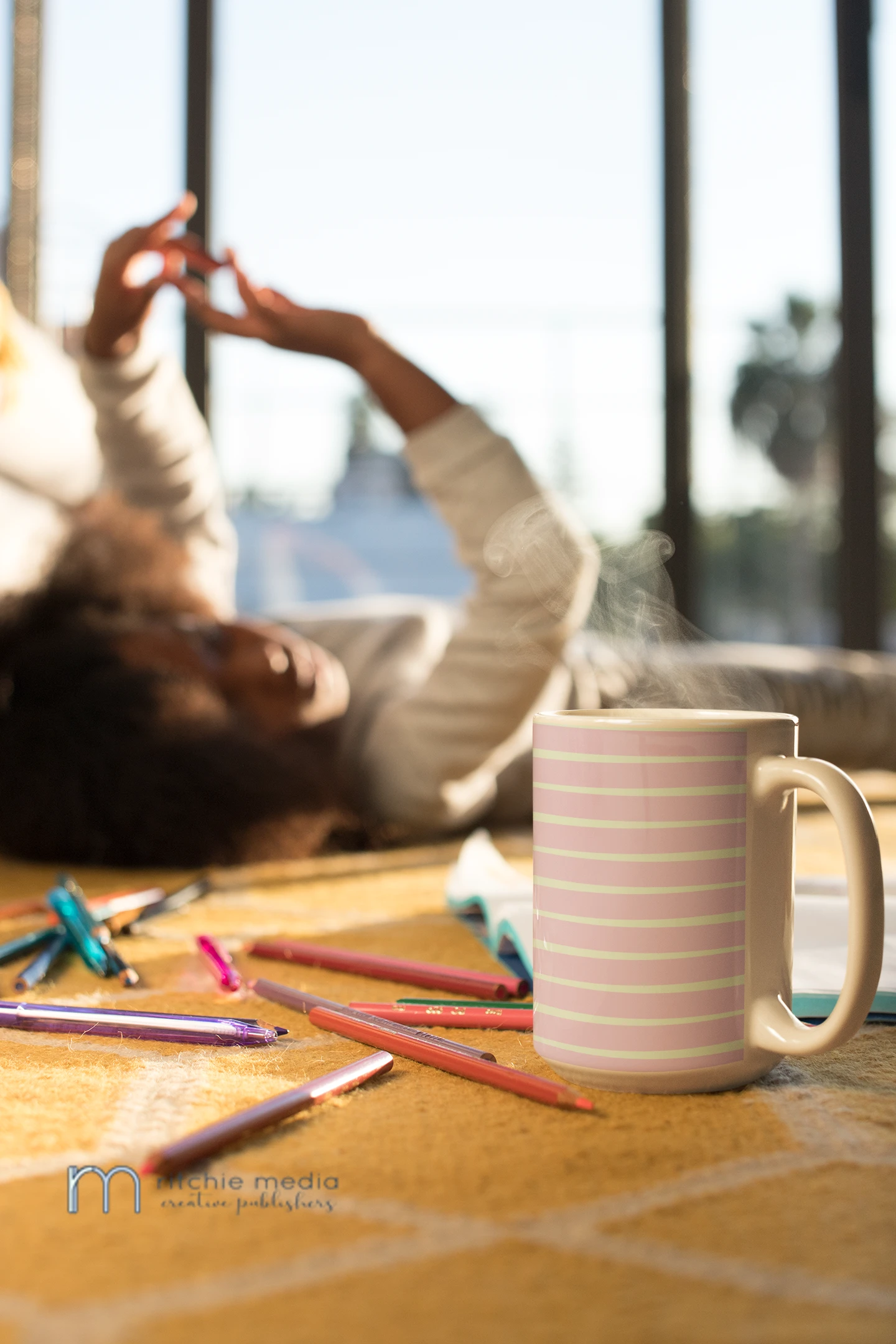 hot-chocolate-mug-mockup-featuring-a-girl-and-color-pencils-24011