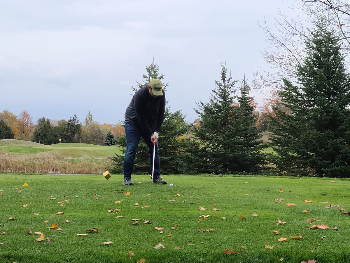 picture of man taking a golf shot